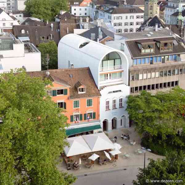 Herzog & de Meuron inserts arched apartment behind old facade in Austria