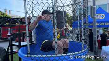 Local leaders take part in annual dunk tank fundraiser