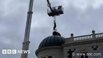 Theatre's well-known statue returns to its plinth