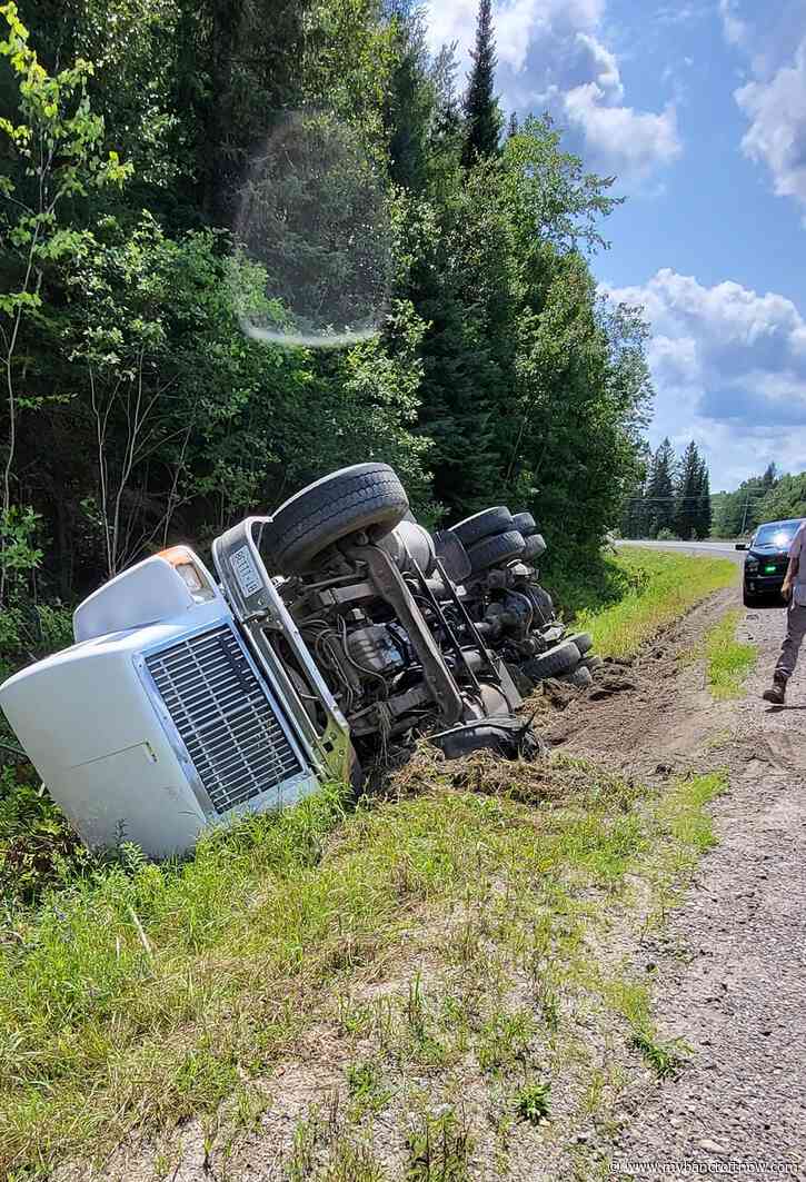 Driver uninjured after dump truck flips into the ditch