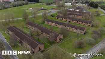 Ex-RAF base 'prison-like' for migrants, court told