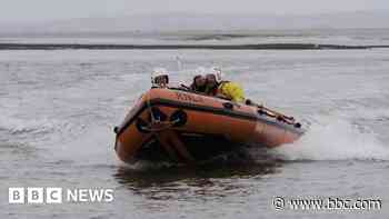 Man and a dog found treading water after tidal cut-off