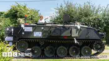 Bride rolls up to wedding in armoured tank