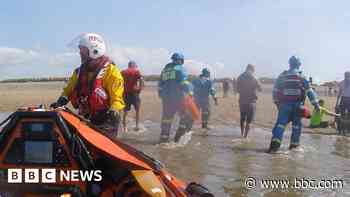 Family cut off by tide rescued by lifeboat
