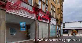 Vandals smash windows and douse Barclays branch in red paint in 'protest'