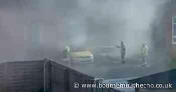 Car set alight in Poole church car park as fire rush to put it out