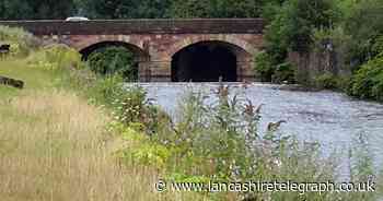 One taken to hospital after three people rescued from river by fire service