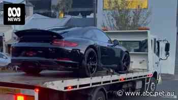 Money launderers jailed after police seize bags of cash, a Porsche and portraits of Mike Tyson