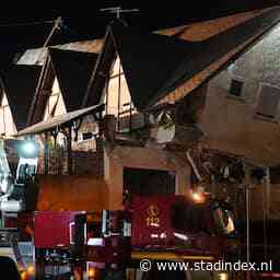 Vrouw en kind uit Urk uit puin Duits hotel gered, man nog bekneld