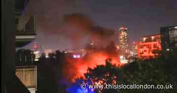Huge fire destroys canal boat as explosion warning issued