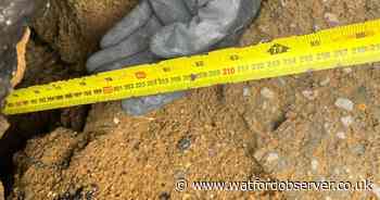 Two-by-two-metre hole in road excavated as 'large void' cause sought