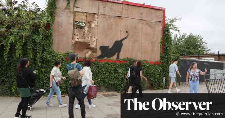 Banksy’s billboard cat removed as meaning of his London animals revealed