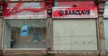 Contractors boarding up vandalised Barclays bank abused and assaulted