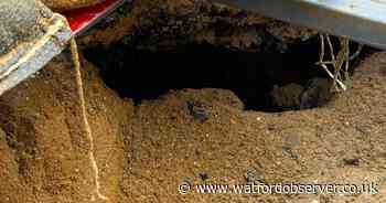 Cause of 'large void' that opened up in town centre road revealed