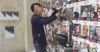 Man arrested after posters of Israeli hostages torn down