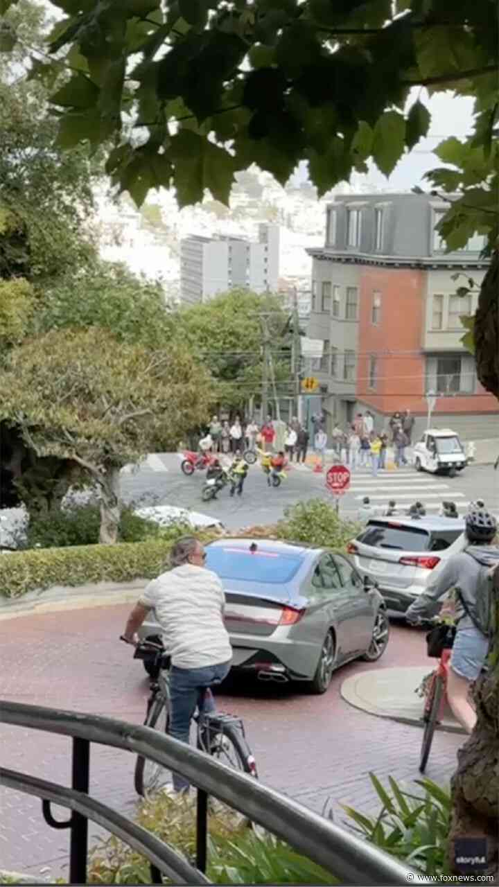 WATCH: San Francisco traffic officer circled by masked motorcyclists in tourist area