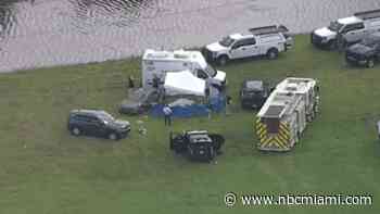 Police investigating after body found in car pulled from canal in Sunrise