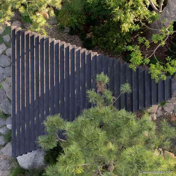 Temp nestles charred-wood pavilion in rocky Shanghai garden
