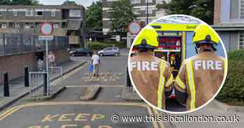 Three people rescued from burning flat by firefighters