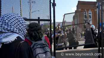 Protesters detained after breaking through security fence near DNC