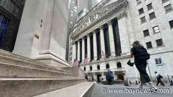 Wall Street hangs near its records after an 8-day winning streak