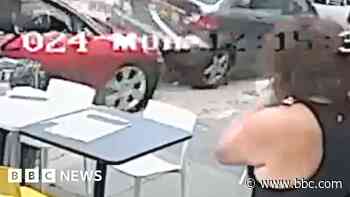 Watch: Cars crash off road in near-miss with cafe