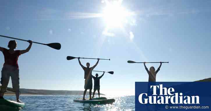 How paddleboarding conquered Britain: the delights and dangers of the nation’s fastest-growing sport