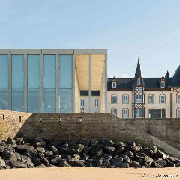 Slim concrete colonnade fronts D-Day Museum in Normandy