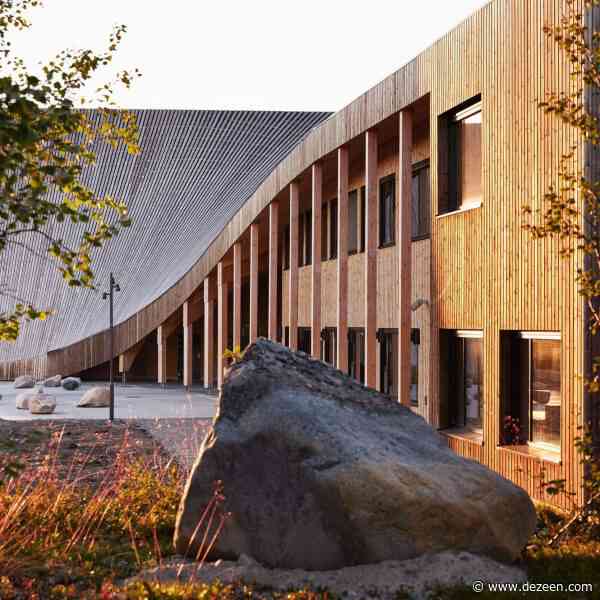 Snøhetta tops reindeer herding school with sloping wooden roof