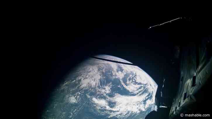 Spacecraft swoops between moon and Earth, captures stunning footage