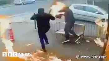 Arsonists set themselves on fire as they target shop