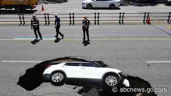 2 hurt after SUV swallowed by sinkhole