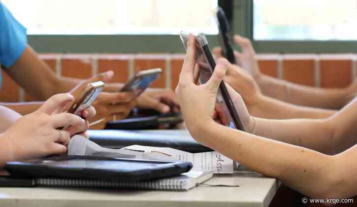 How do some New Mexico schools handle cell phones in the classroom?