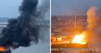 Explosions reported as film set fire in east London 'spreads out of control'