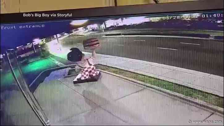 Violent high-speed crash 'partially decapitates' statue outside fast food joint