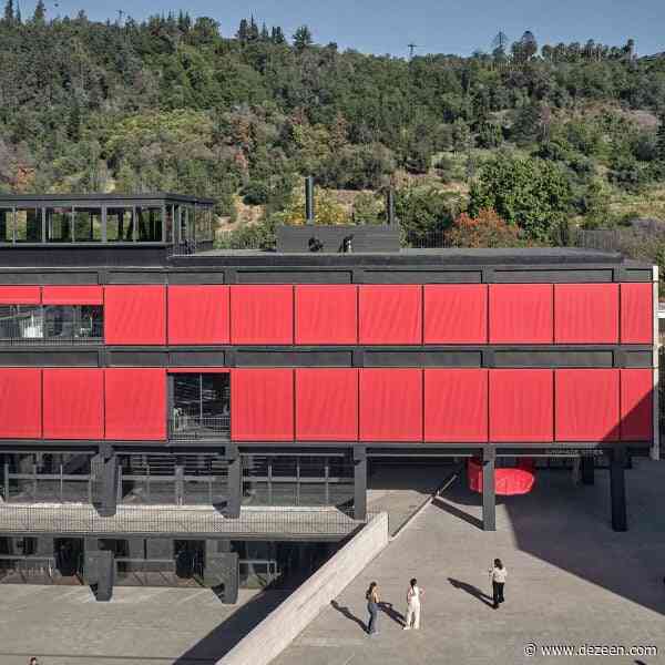 Red curtains line facade of FADEU Building at Santiago architecture school
