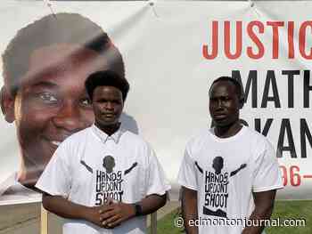'Hands up, Don't shoot:' Protesters take call for justice to Edmonton police station near scene of June shooting