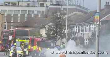 Car catches fire in street as emergency services close road