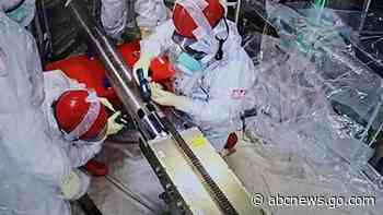 A robot has begun a 2-week mission to retrieve melted fuel from the damaged Fukushima nuclear plant