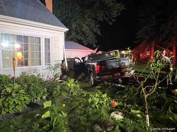 Man charged after truck drives into home in Newfane