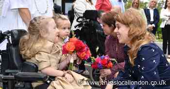 Royal princesses visit east London hospice garden party - in pictures