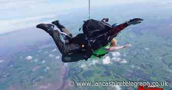 Parents skydive 15,000 feet for children’s hospice that cared for their sons
