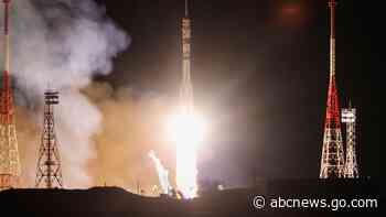 A Soyuz craft with 2 Russians and 1 American docks at the International Space Station