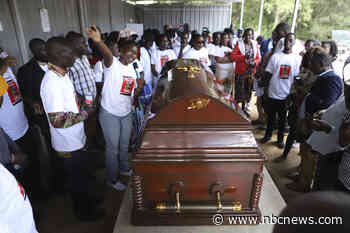 Slain Ugandan Olympian buried with full military honors