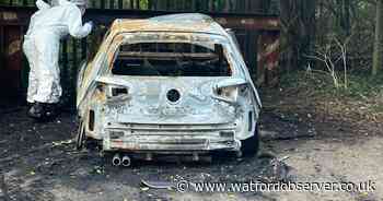 Forensics investigate shell of car linked to fatal shooting