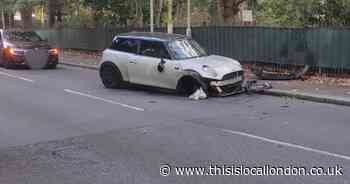 Crash closes road near hospital following police chase