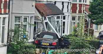 Audi crashes into front of house during rush hour