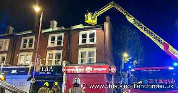 Fire above high street shop damages flat