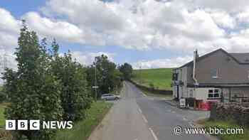 Man critical after car overturns and hits building