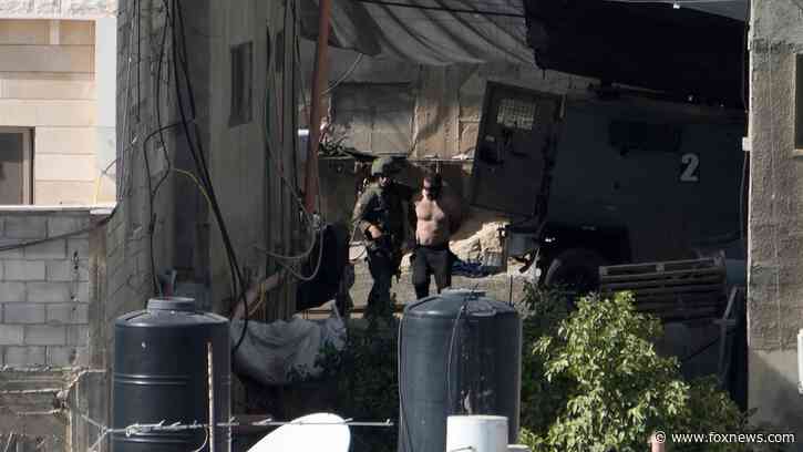 Israel reviewing incident of soldiers tossing bodies off rooftop in West Bank